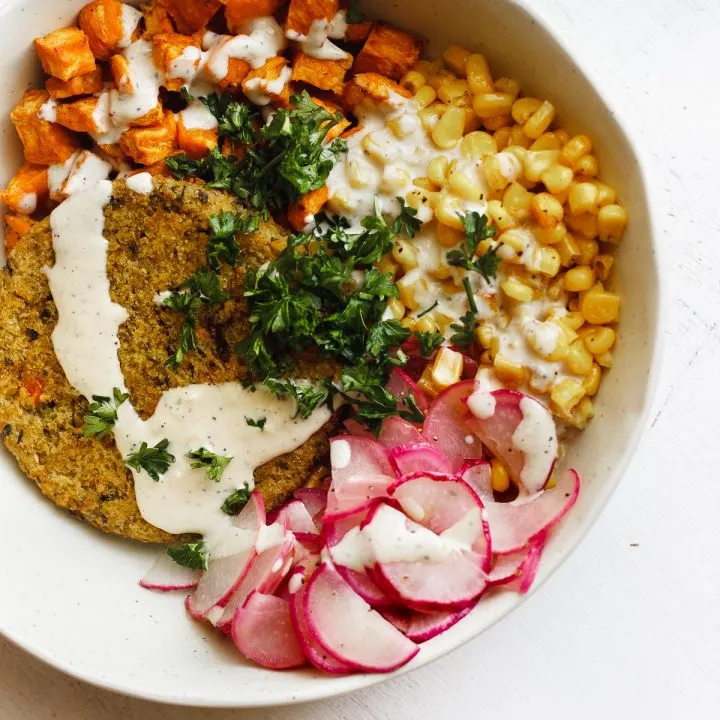 veggie burger bowl with corn and tahini