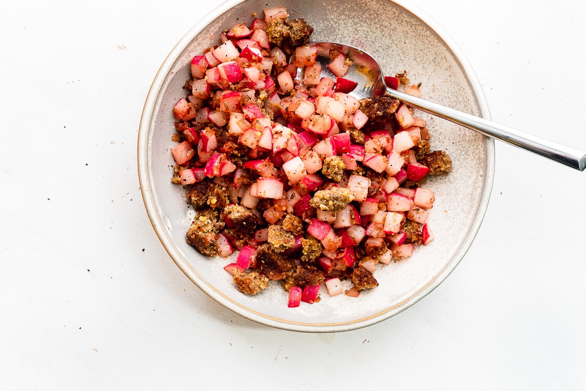 diced radishes with veggie sausage in a bowl