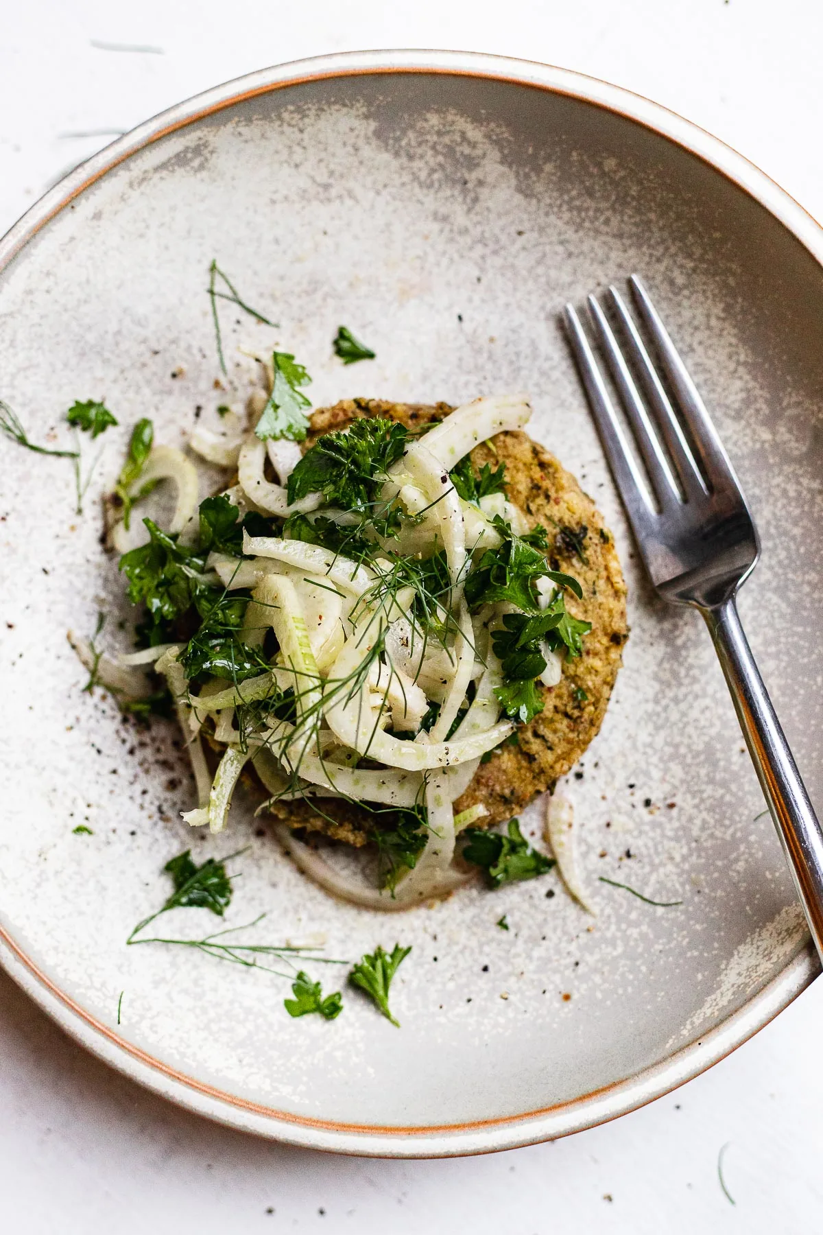 shaved fennel slaw on top of a veggie burger