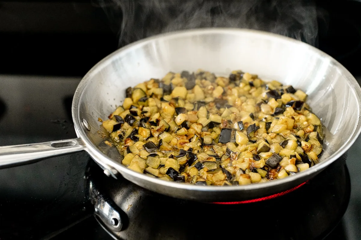 eggplant frying in a pan