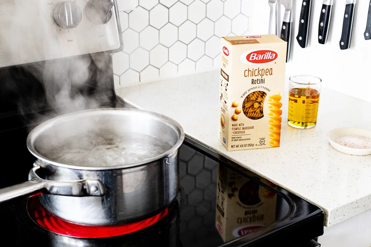 barilla pasta next to a pot of boil water