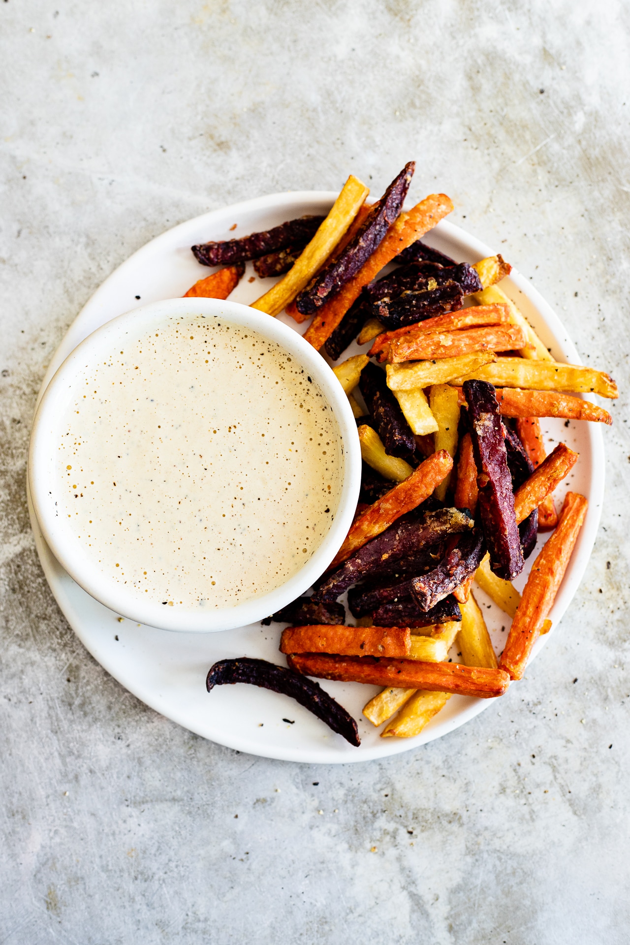 garlic tahini cream sauce with root vegetable fries