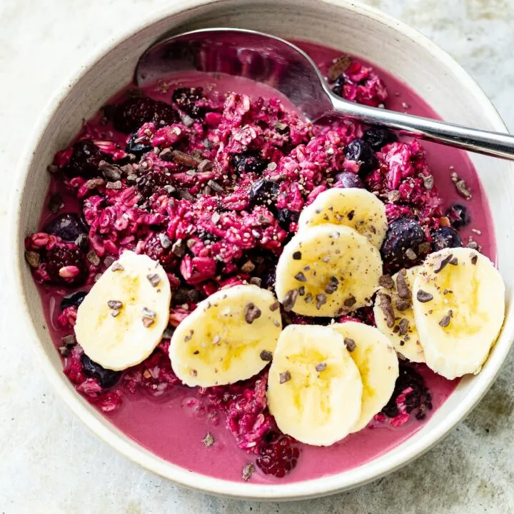 bowl of berry overnight oats with banana