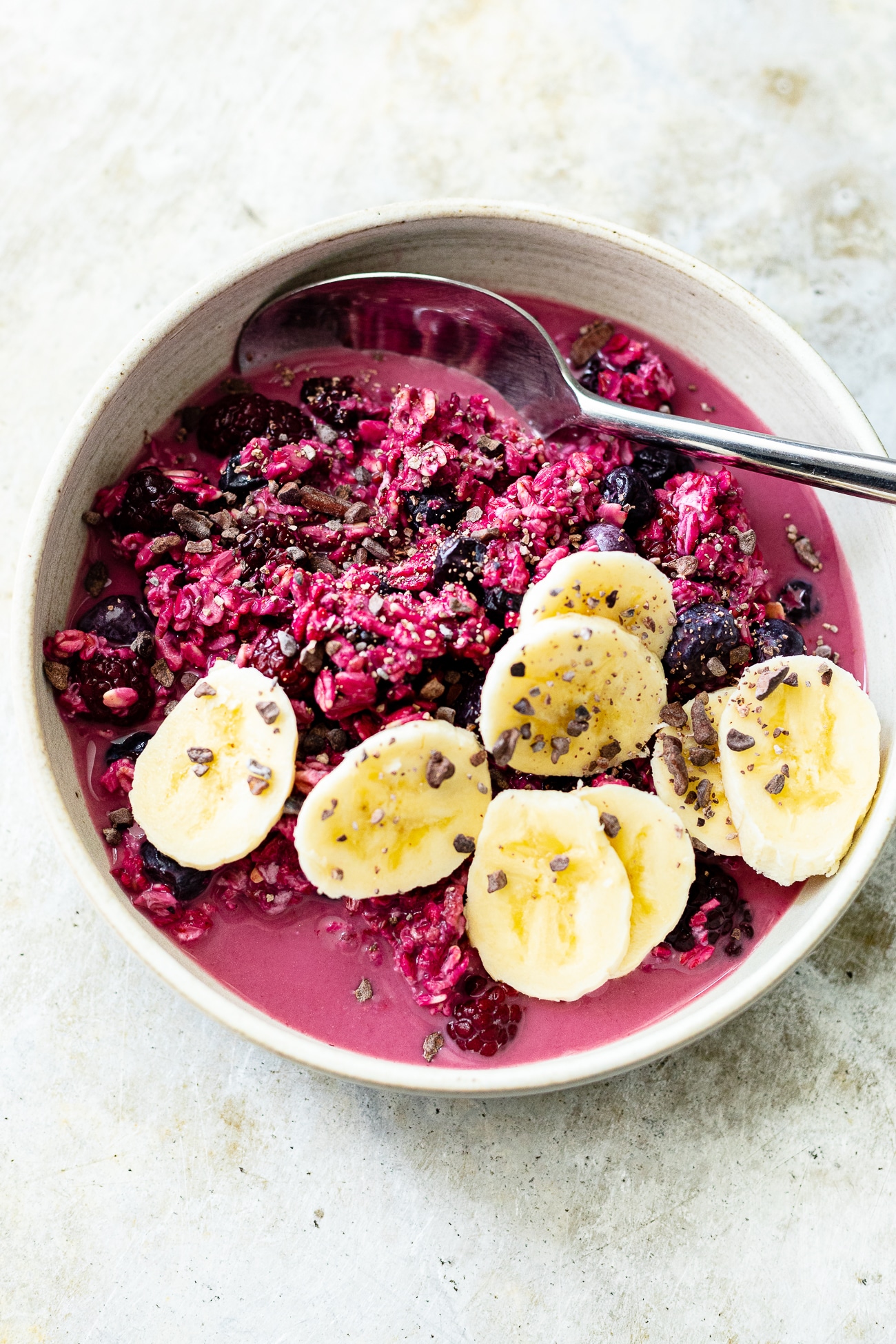 bowl of berry overnight oats with banana